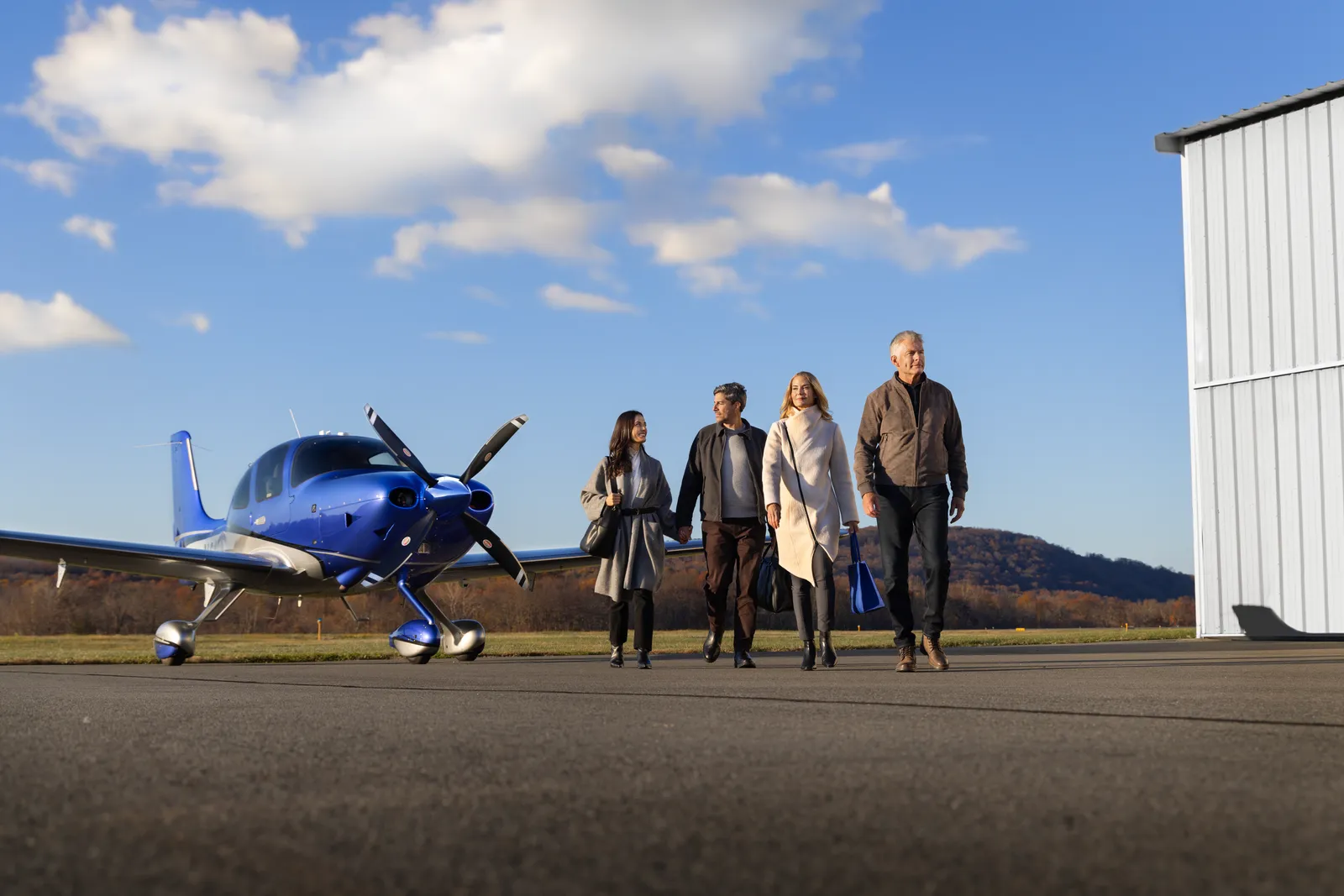 Family arriving at their Cirrus — weekend adventure begins