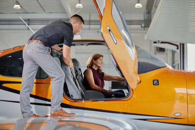 Cirrus training aircraft flying above cloud layers